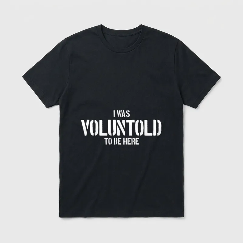 Voluntold Veteran T-Shirt – I WAS VOLUNTOLD TO BE HERE in white block letters – Classic T-Shirt in Black