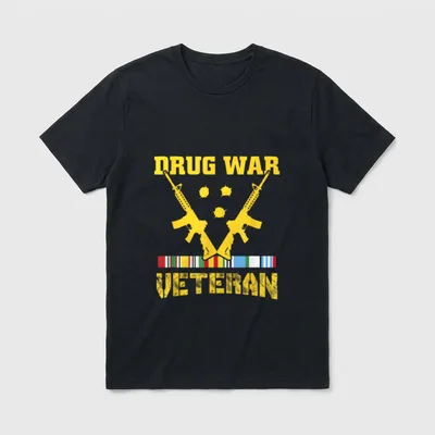USA Freedom Veteran T-Shirt – DRUG WAR and VETERAN in yellow text with rifles and medal ribbons – Classic T-Shirt in Black