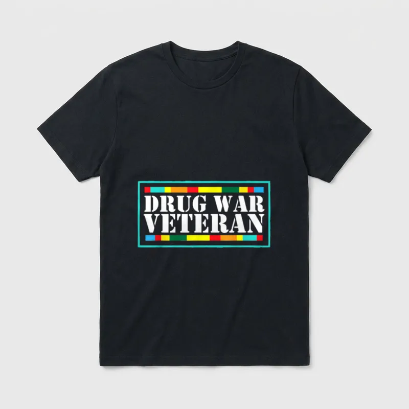 Drug War Veteran T-Shirt – White text reading DRUG WAR VETERAN in large letters – Classic T-Shirt in Black